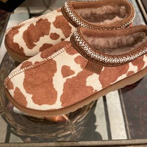 Ugg Tasman Cow Print . Size 8 . Never worn . Excellent condition .